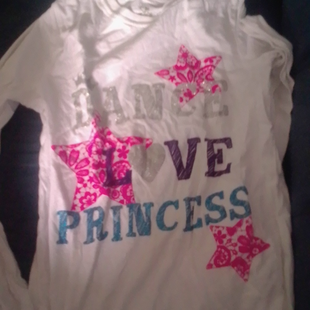 A white and colorful girls shirt
